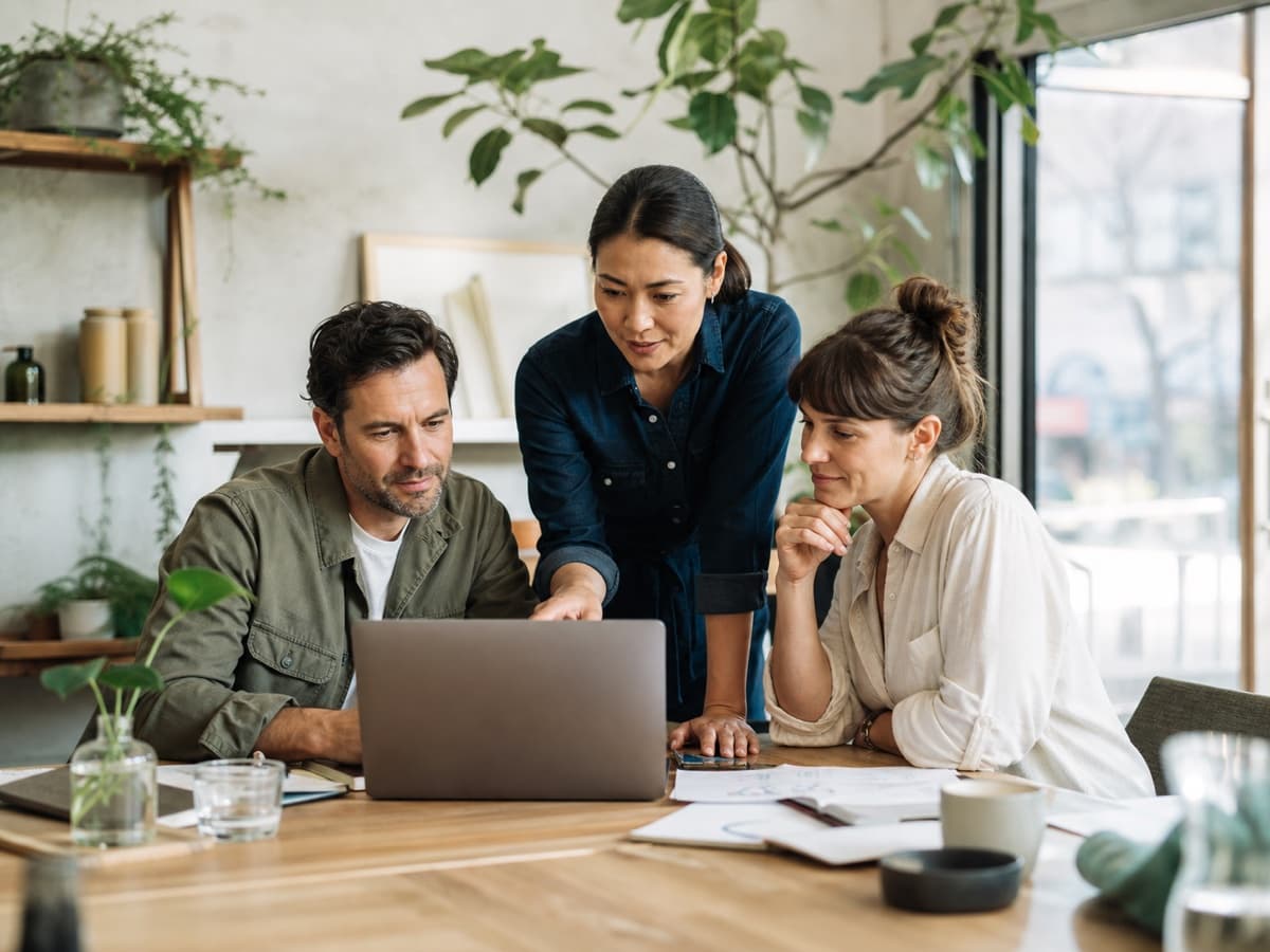 Australian business owners reviewing plans together in a bright workspace